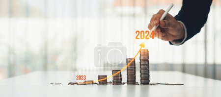 Photo for Growth coin stack symbolizing business investment and economic growth. Business people doing financial planning to achieve financial goal and contribute maximum profit on new year 2024 . Shrewd - Royalty Free Image