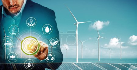 Photo for Double exposure graphic of business people working over wind turbine farm and green renewable energy worker interface. Concept of sustainability development by alternative energy. uds - Royalty Free Image