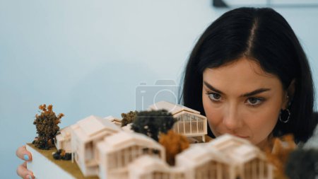 Photo for Cropped image of caucasian skilled architect engineer focus on checking architectural model. Checking inspect house model structure and quality. Creative design concept. Closeup. Immaculate. - Royalty Free Image