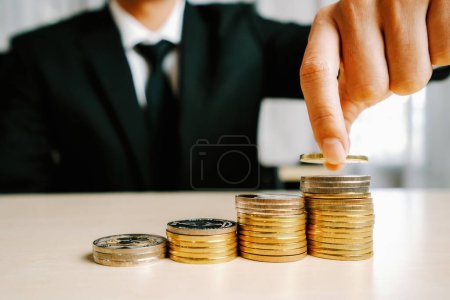Photo for Businessman working with coin money currency. Concept of investment growth and money saving. uds - Royalty Free Image