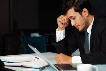 Photo for Unhappy young man, businessman feels stress at the office because of economic crisis and awful company loss. Business failure concept. uds - Royalty Free Image