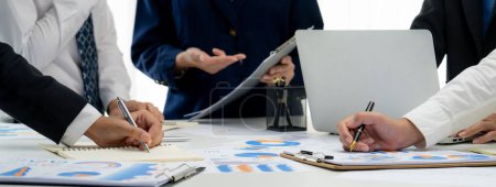 Photo for Business people in group meeting in formal attire share idea discussing report for company profit in creative workspace for start up business shot in close up view on group meeting table . Oratory . - Royalty Free Image