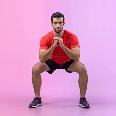 Photo for Full body length gaiety shot athletic and sporty young man with fitness in squat exercise posture on isolated background. Healthy active and body care lifestyle. - Royalty Free Image