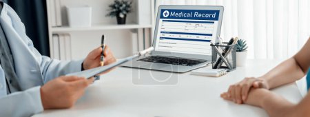 Photo for Focused laptop display medical report or diagnostic result of patient health on blurred background of doctors appointment in hospital. Medical consultation and healthcare treatment. Panorama Rigid - Royalty Free Image