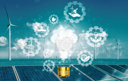 Foto de Bombilla de luz de innovación energética verde con futura industria de la interfaz gráfica de iconos de generación de energía. Concepto de desarrollo sostenible mediante energías alternativas. BARROS - Imagen libre de derechos