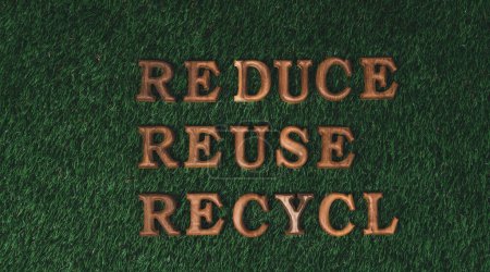 Photo for Environmental awareness campaign showcase arranged recycle message in on biophilic green grass background. Environmental social governance concept idea for sustainable and greener future. Gyre - Royalty Free Image