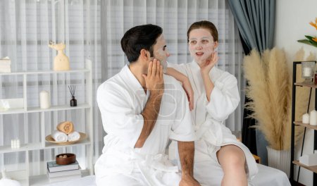 Photo for Serene modern daylight ambiance of spa salon, couple customer indulges in rejuvenating with facial skincare mask. Facial skin treatment and beauty cosmetology procedure for face. Quiescent - Royalty Free Image