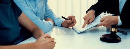 Photo for Couples file for divorcing and seek assistance from law firm to divide property after breakup. Obligations contract assist by lawyer in negotiating settlement agreement meeting. Panorama Rigid - Royalty Free Image