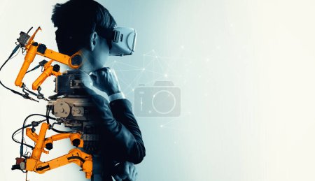 Téléchargez les photos : Technologie XAI Future VR pour la commande de bras robotisée industrielle mécanisée. Concept de technologie robotique pour la révolution industrielle et les processus de fabrication automatisés. - en image libre de droit