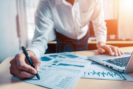 Photo for Businessman accountant or financial expert analyze business report graph and finance chart at corporate office. Concept of finance economy, banking business and stock market research. uds - Royalty Free Image