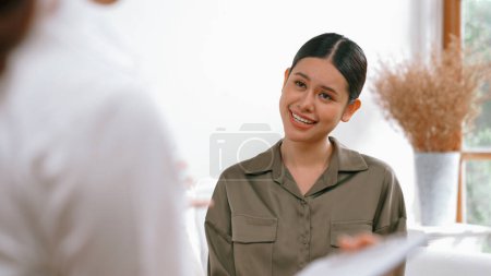 Photo for Happy patient and psychologist exchanging mental health conversation in clinic with positive emotion while explaining successful work and life to psychologist at psychologist vivancy clinic office - Royalty Free Image
