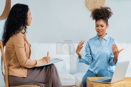 Photo for Happy patient and psychologist have mental health conversation in clinic with positive emotion while explaining crucial successful work and life to psychologist in home office - Royalty Free Image