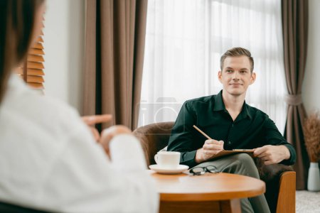 Photo for Psychological consultation gaining improvement on mental problem, happy young female patient doing therapy session while psychiatrist making diagnostic on mental illness. Unveiling - Royalty Free Image