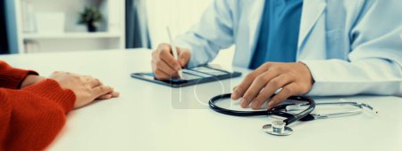 Photo for Patient attend doctors appointment at clinic or hospital office, discussing medical treatment options and explaining examination results or medical record about sickness. Panorama Rigid - Royalty Free Image