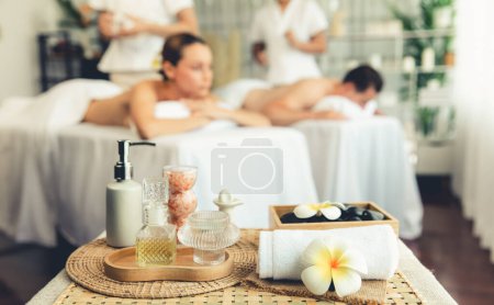 Photo for Aromatherapy massage on daylight ambiance or spa salon composition setup with focus decor and spa accessories on blur woman enjoying blissful aroma spa massage in resort or hotel background. Quiescent - Royalty Free Image