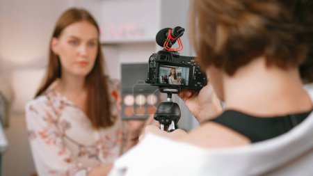 Photo for Two influencer partner shoot live streaming vlog video review makeup prim social media or blog. Happy young girl with cosmetics studio lighting for marketing recording session broadcasting online. - Royalty Free Image