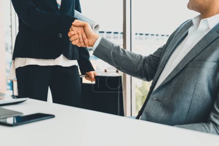 Photo for Businessman executive handshake with businesswoman worker in modern workplace office. People corporate business deals concept. uds - Royalty Free Image