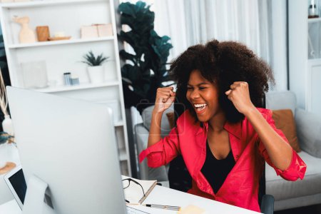 Photo for African woman blogger extremely happy face, looking on screen with valued achievement at high profit with newest company project. Concept of cheerful expression work from home lifestyles. Tastemaker. - Royalty Free Image