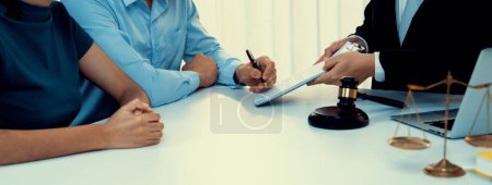 Photo for Loving couple seek legal consultation and assistance from law firm to discuss marriage law, proposal weddings and spousal support. Lawyer providing advice on marriage certification. Panorama Rigid - Royalty Free Image