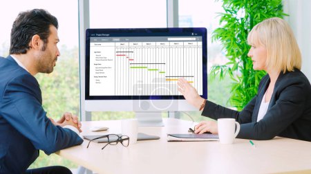 Photo for Project planning software for modish business project management on the computer screen showing timeline chart of the team project - Royalty Free Image