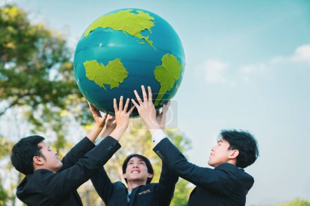 Photo for Earth day concept with big Earth globe held by group of asian business people team promoting environmental awareness to solve global warming with environmentally sustainability and ESG principle. Gyre - Royalty Free Image