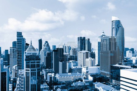 Photo for Closeup image of Bangkok cityscape. Modern skyscrapers with monochrome blue filter. Modern architectural building skyline with blue sky. Side view. Business background. Day light. Ornamented. - Royalty Free Image