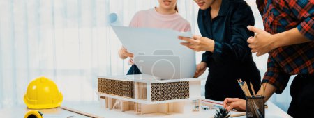 Photo for Architect engineer team discussion about house construction. Interior designer working together and brainstorming to analysis house structure. Creative design and teamwork concept. Burgeoning.. - Royalty Free Image