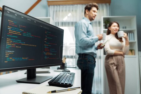 Photo for Coding software screens newest creative website on working desk against on developers program drinking coffee to discuss with standing together at corner blurry background with side view. Postulate. - Royalty Free Image