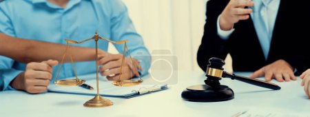 Photo for Lawyer acting as mediator broke a compromise between two parties to resolve business dispute through negotiation at law firm office. Legal mediation and conflict resolution service. Panorama Rigid - Royalty Free Image