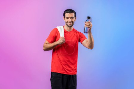 Photo for Full body length gaiety shot athletic and sporty young man with towel and drinking water in fitness exercise posture on isolated background. Healthy active and body care lifestyle. - Royalty Free Image