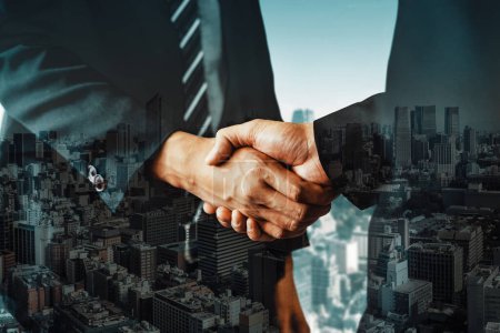Photo for Double exposure image of business people handshake on city office building in background showing partnership success of business deal. Concept of corporate teamwork, trust partner and work agreement. - Royalty Free Image