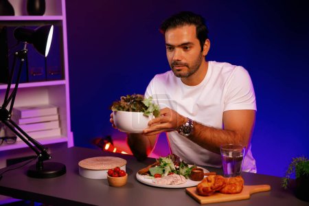 Healthy influencer in host channel presenting cold fresh vegetables on diet life in special dish of salad for easy cooking product by self with tasty food on social media live on meal time. Surmise.