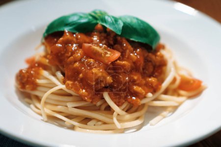 Photo for Close up health foods recipe Ingredients of special menu homemade cooking raw spaghetti with tomato sauce and basil of macro photo focus shooting placing elements serving on white plate. Postulate. - Royalty Free Image