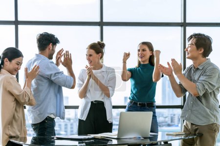 Photo for Portrait of diverse professional start up project team celebrate their project. Group of business people clapping hand, high five, cheer up for celebrating new product on table with laptop. Tracery. - Royalty Free Image