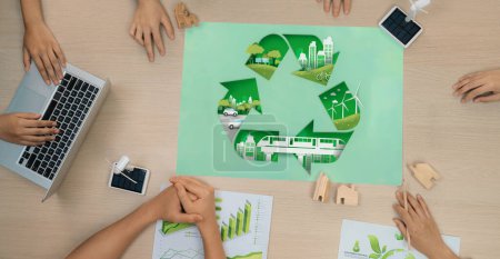 Photo for Eco city and recycle illustration placed on a meeting table during a green business meeting discussion. ESG environment social governance and Eco conservative concept. Top view. Delineation. - Royalty Free Image