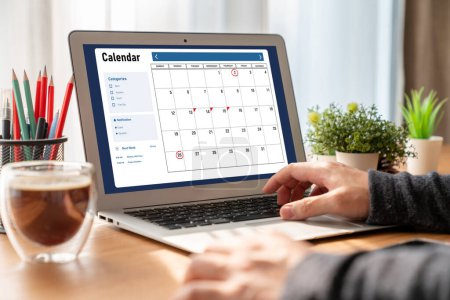 Photo for Calendar on computer software application for modish schedule planning for personal organizer and online business - Royalty Free Image