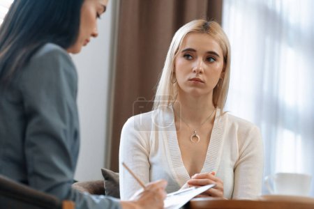 Photo for Psychological consultation on mental health or seeking help from professional, young patient on therapy session while psychiatrist making diagnostic on mental illness. Mental treatment session. Blithe - Royalty Free Image