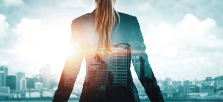 Photo for Double Exposure Image of Business Person on modern city background. Future business and communication technology concept. Surreal futuristic cityscape and abstract multiple exposure interface. uds - Royalty Free Image