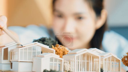 Photo for Closeup of young beautiful architect engineer measure house by using pencil. Interior designer pointing pencil to design house structure. Business design concept. Blurring background. Manipulator. - Royalty Free Image