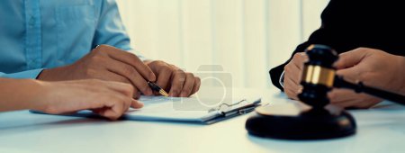 Photo for Client relying on law firm to provide legal counsel and advice with lawyers or attorney review and analyze complex legal contract document as trusted corporate law consultation service. Panorama Rigid - Royalty Free Image