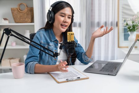 Photo for Host channel of young beautiful Asian wearing jeans creative broadcaster talking in online broadcast explaining to promote marketing or consultant in daily life with listener at studio. Stratagem. - Royalty Free Image
