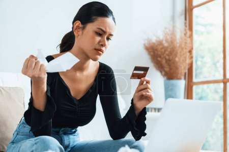 Photo for Stressed young woman has financial problems with credit card debt to pay uttermost show concept of bad personal money and mortgage pay management crisis. - Royalty Free Image