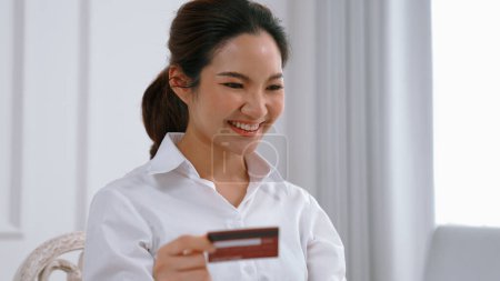 Photo for Woman shopping or pay online on internet marketplace browsing for sale items for modern lifestyle and use credit card for online payment from wallet protected by vivancy cyber security software - Royalty Free Image