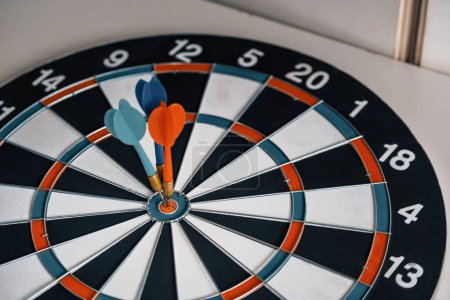 Photo for Concept of challenge in business marketing bullseye and intelligent customer reaching. The dart is the strategy or skill. The dartboard is the target or goal. uds - Royalty Free Image