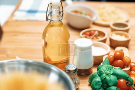 Photo for Health foods ingredients of special menu homemade cooking oil, radish, garlic, salt, oregano, basil, tomato and seasonings placing elements on preparing wooden table on blurred background. Postulate. - Royalty Free Image
