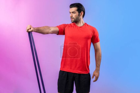 Photo for Full body length gaiety shot athletic and sporty young man with fitness elastic resistance band in standing posture on isolated background. Healthy active and body care lifestyle. - Royalty Free Image
