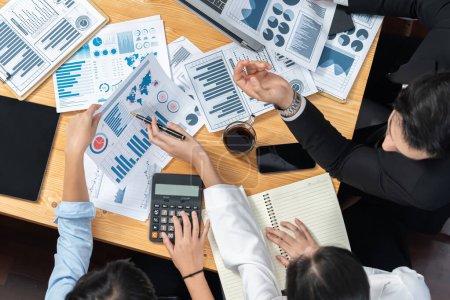 Corporate budget, executive utilize cutting-edge business intelligence financial data dashboard paper on meeting table. Accountant or auditor team examine and calculate income and expense. Meticulous