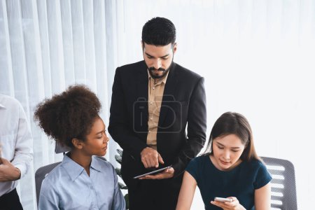 Photo for Happy diverse business people work together, discussing in corporate office. Professional and diversity teamwork discuss business plan on desk with laptop. Modern multicultural office worker. Concord - Royalty Free Image