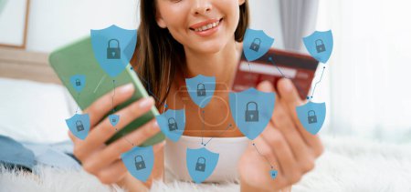 Photo for Elegant customer wear tank top relaxed controlling laptop screen opening hologram graphic interface of technology security, identity protection system, using credit card for authentication. Cybercash. - Royalty Free Image