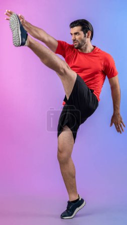 Photo for Full body length gaiety shot athletic and sporty young man with fitness in cardio exercise, kicking position posture on isolated background. Healthy active and body care lifestyle. - Royalty Free Image